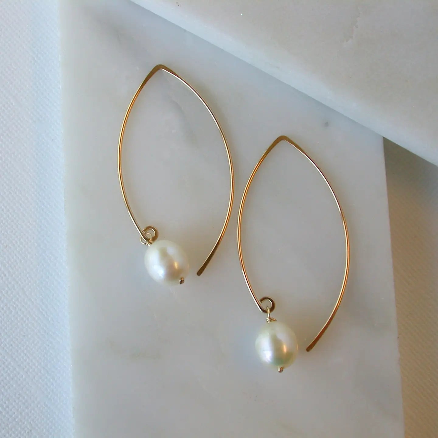 open marquise curving shape earrings - large pearl