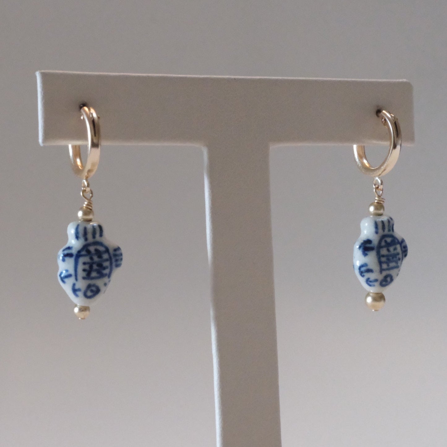 shannon len / ceramic fish tiny tube hoop earrings