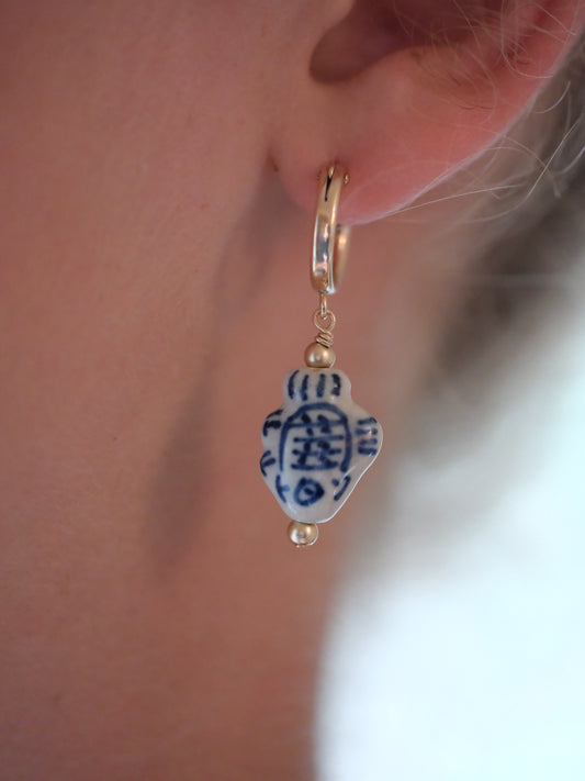 shannon len / ceramic fish tiny tube hoop earrings