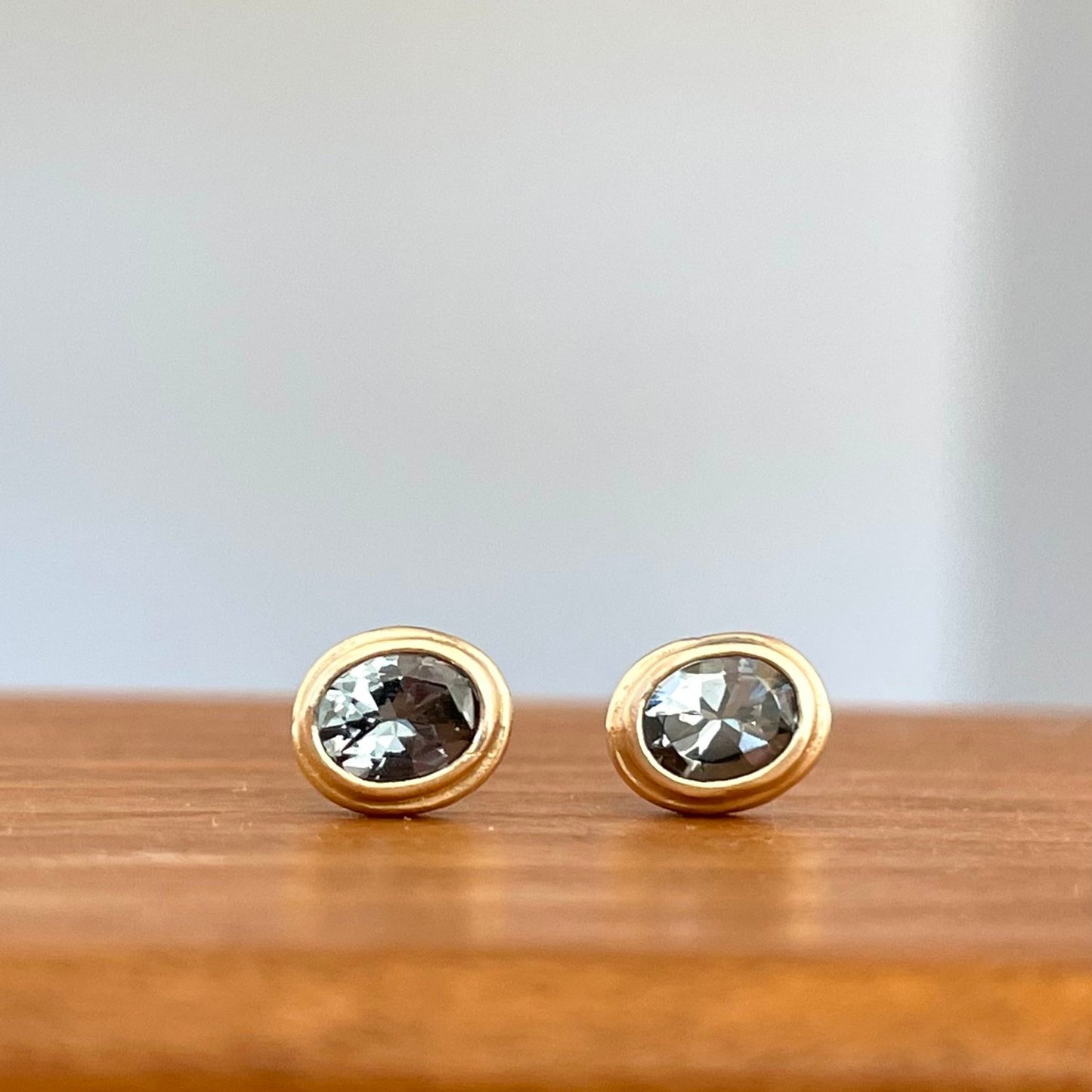 steely blue spinel oval stud earrings