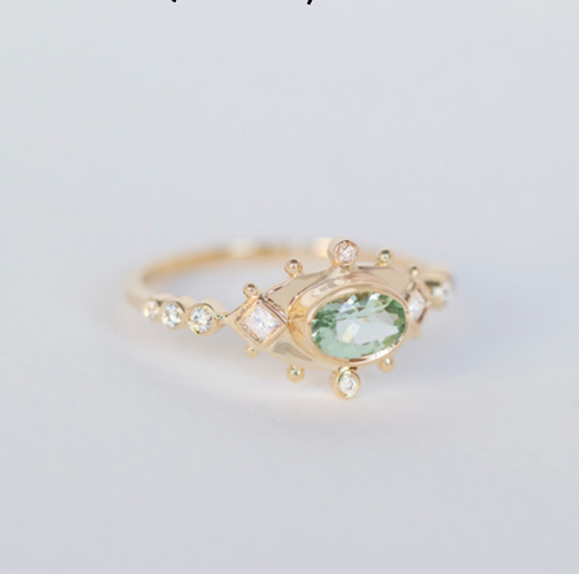 light green tourmaline & diamond eye ring