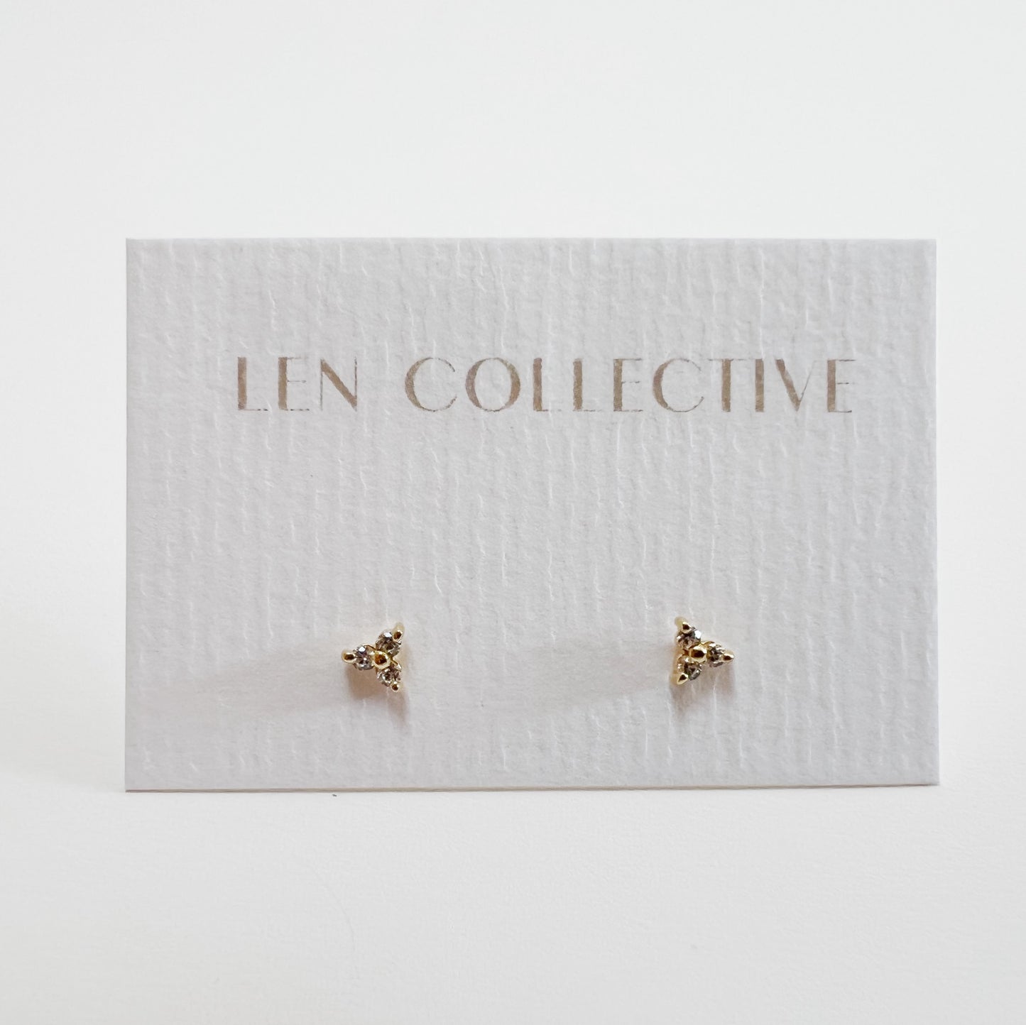 triangle stone stud earrings - cz