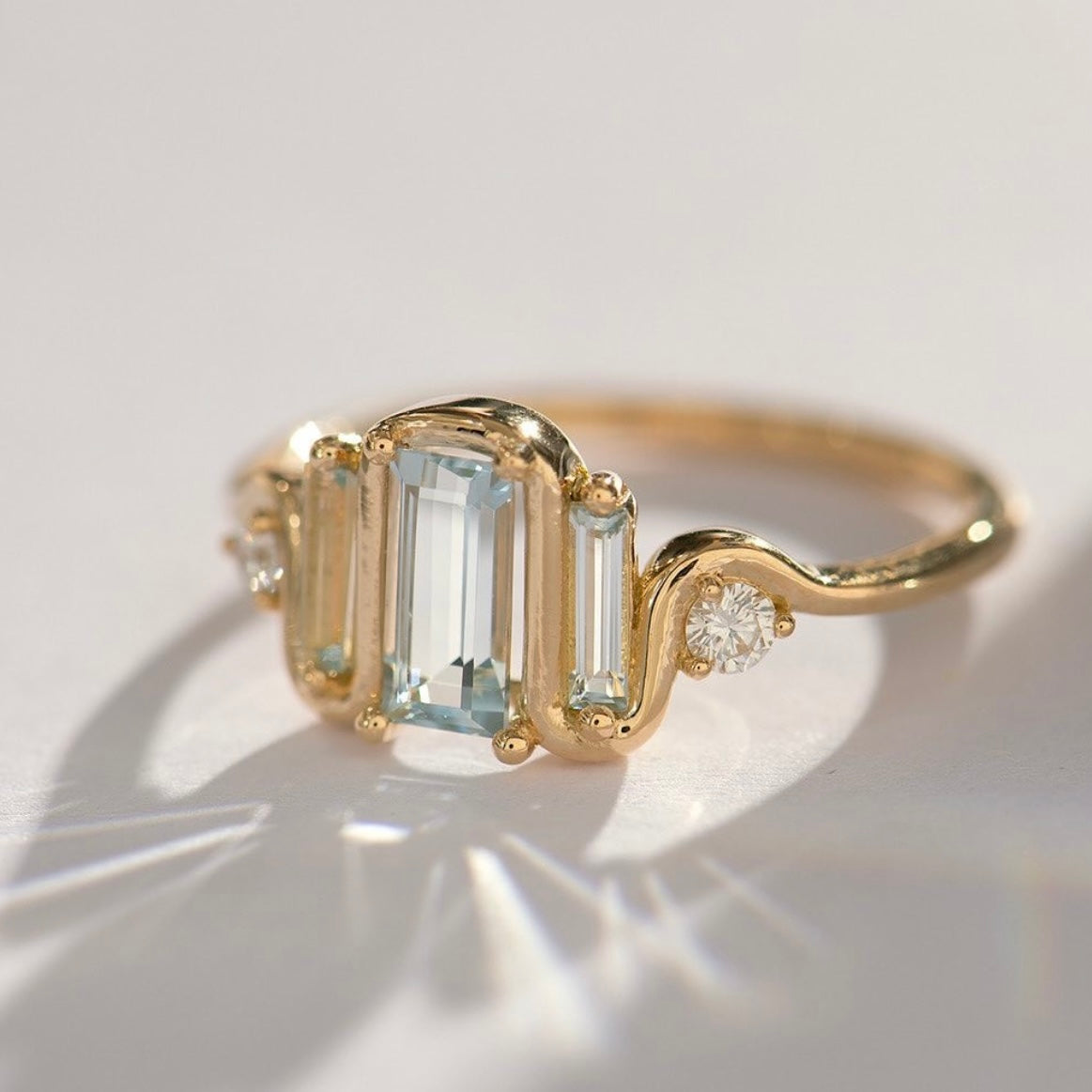 triple baguette aquamarine wave ring
