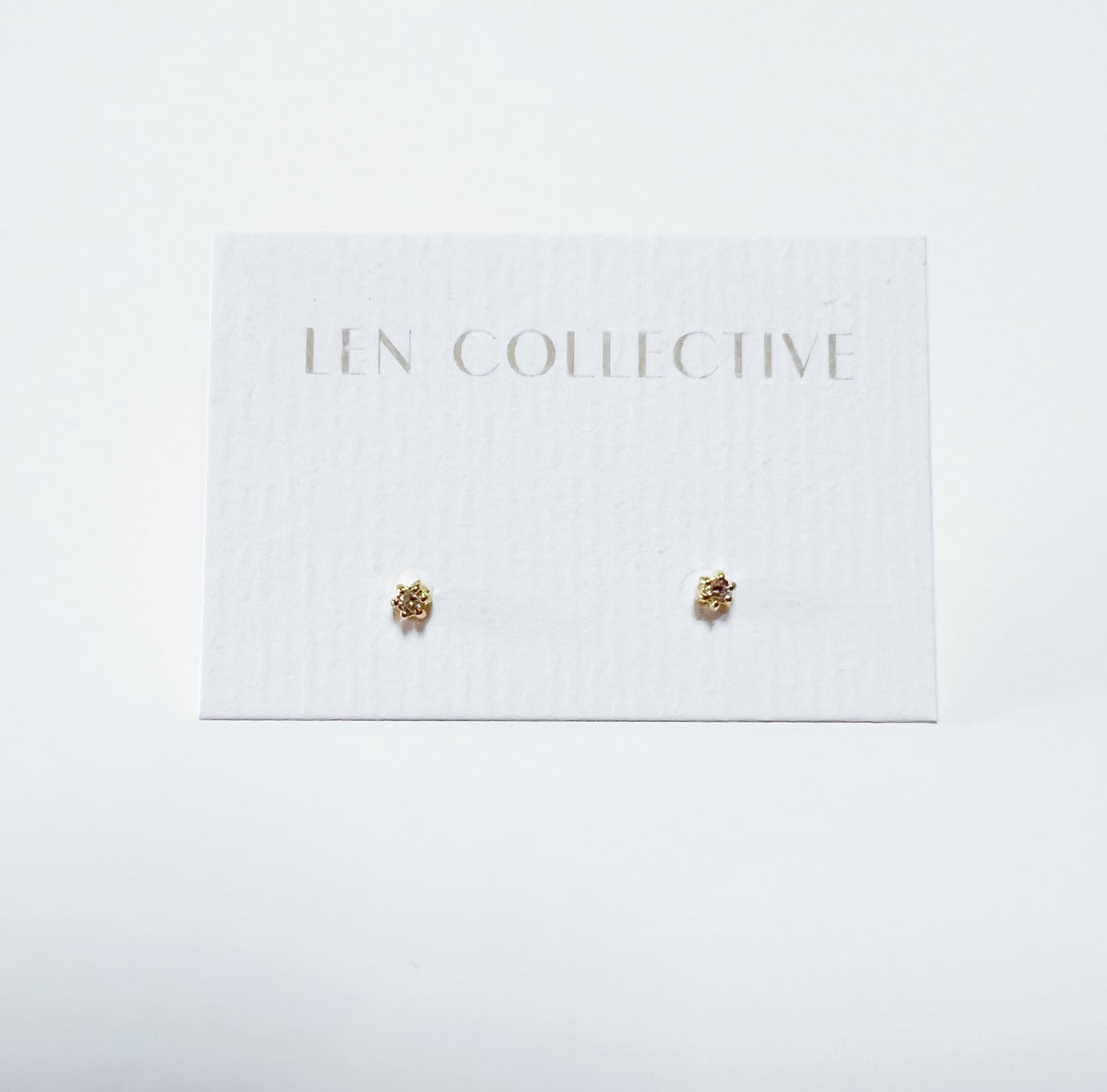 tiny claw-set stud earrings