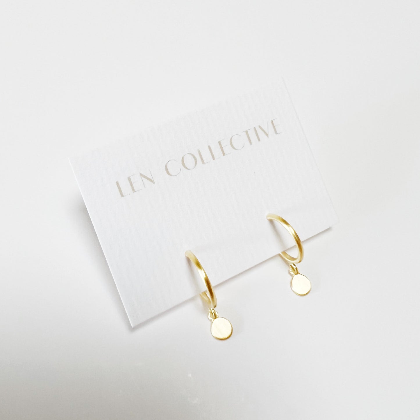 dangling disc post hoop earrings
