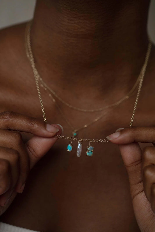 wwake / medium oval solo opal charm
