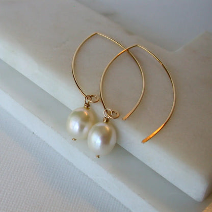 open marquise curving shape earrings - large pearl