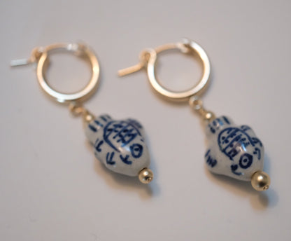shannon len / ceramic fish tiny tube hoop earrings