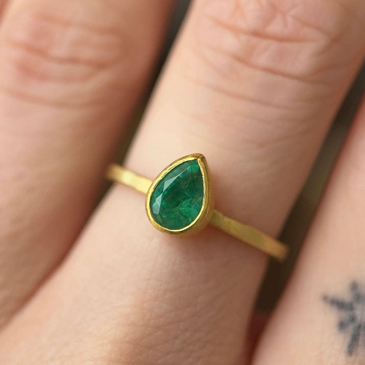 faceted emerald teardrop ring