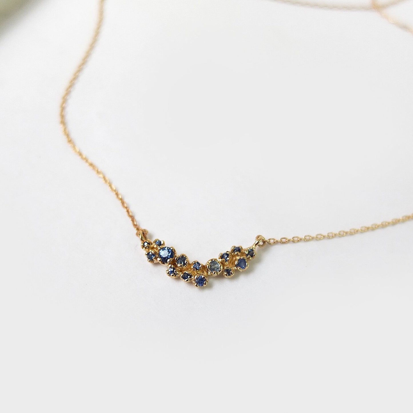 curved cluster necklace - blue sapphire