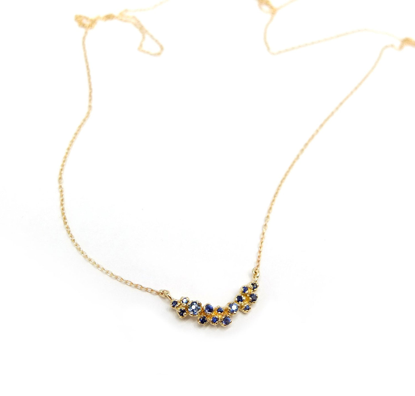 curved cluster necklace - blue sapphire