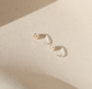 opal glow huggie earrings