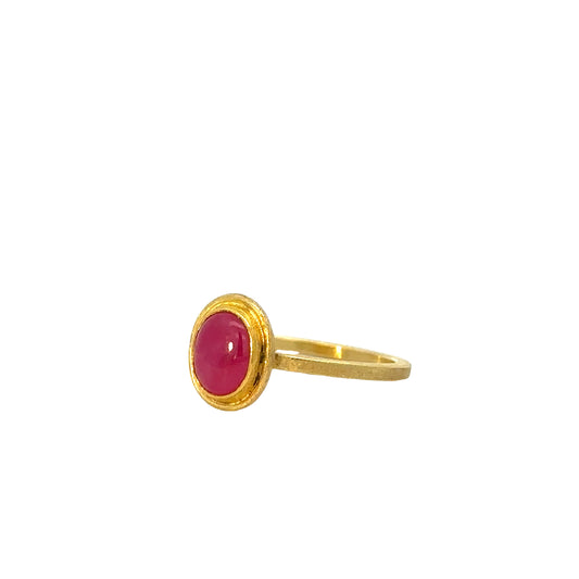 oval ruby cabochon framed ring