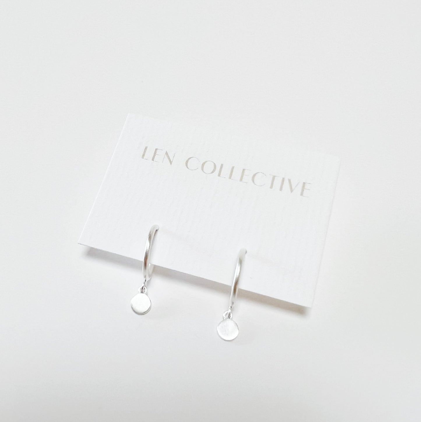 dangling disc post hoop earrings