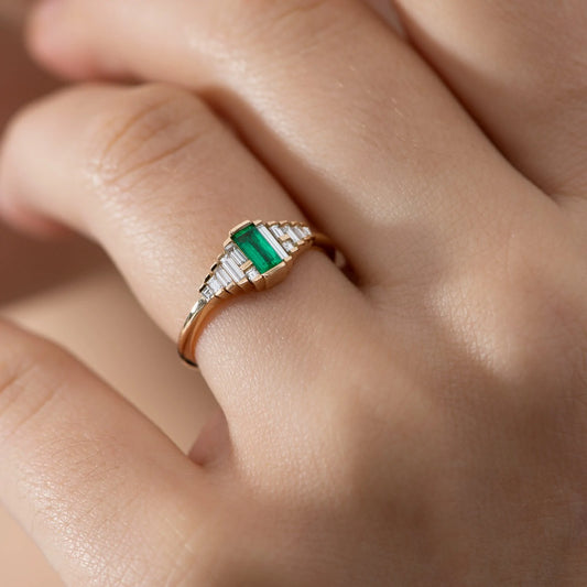 dainty emerald engagement ring with needle baguette diamonds - made to order