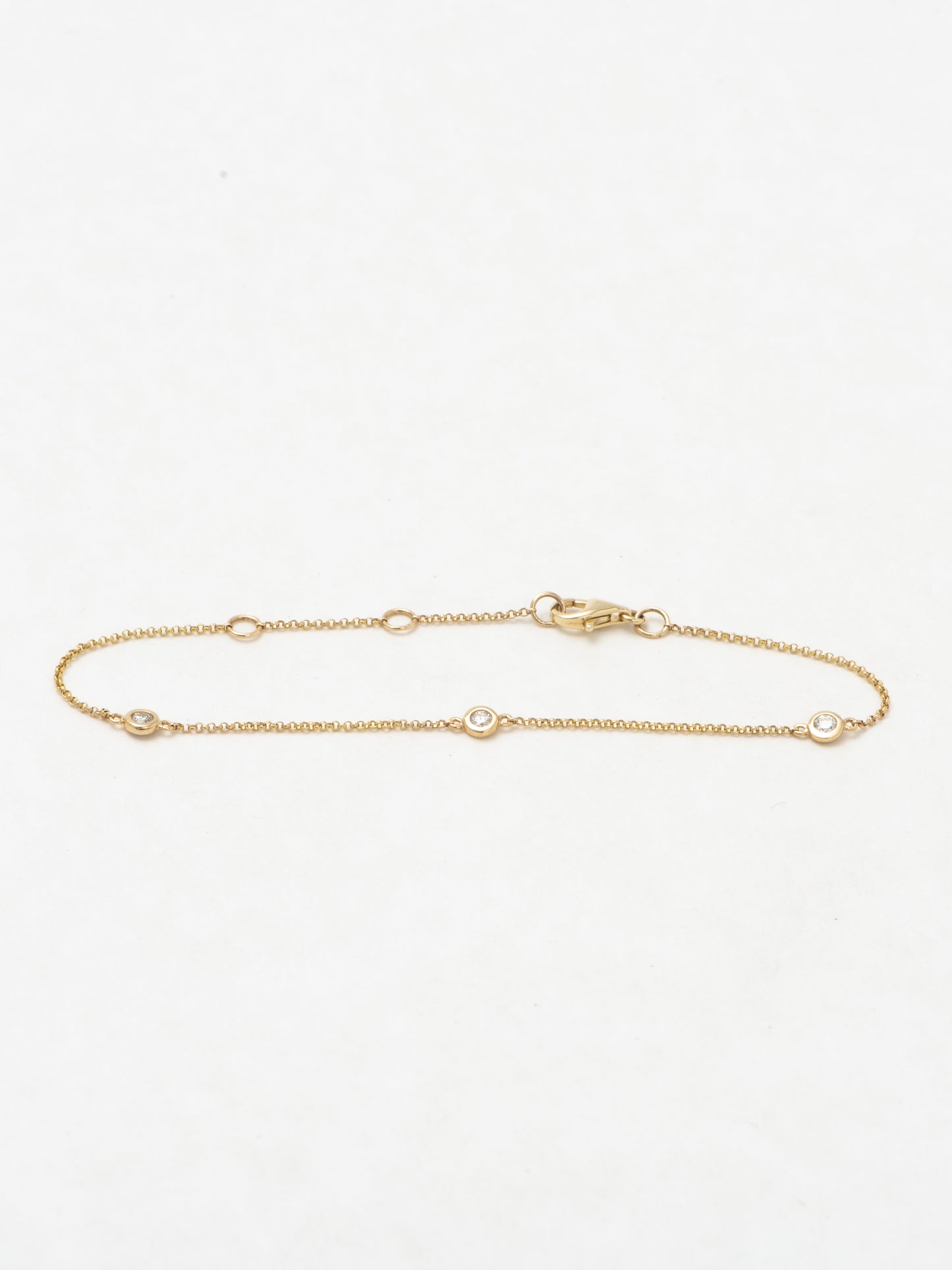 diamond bezel triple-stone bracelet